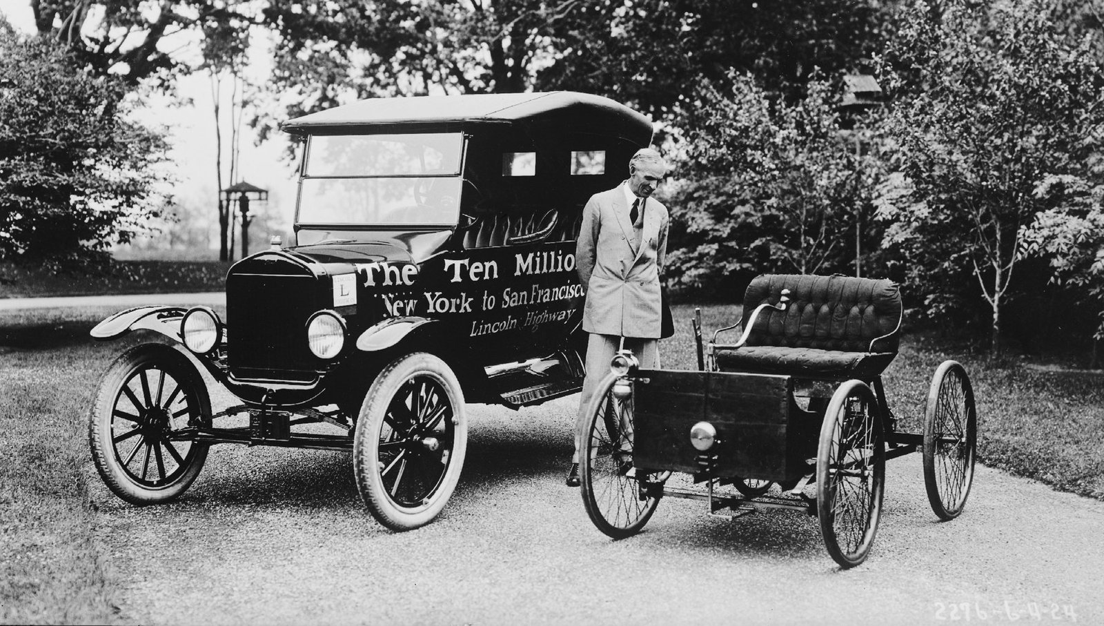 Henry Ford standing between the Quadricycle and the ten-millionth Model T, 1924